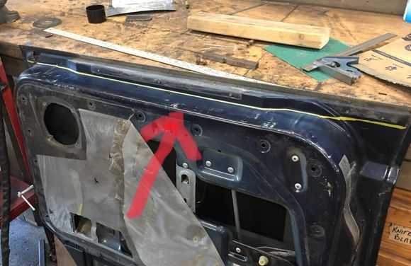 Now for the doors. I cut along the yellow line, flush with the bottom. Cut just the inside panel for now.