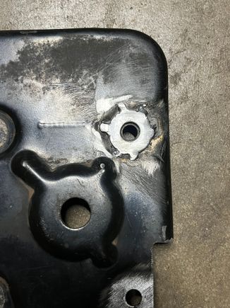 I also tack welded a flat washer into the recessed around of the bolt hole. The washer is slightly higher that the surface of the bracket, for ease of bolting the flat bracket on.