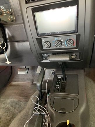 Radio with new USB outlet right in front of parking brake (on center console)