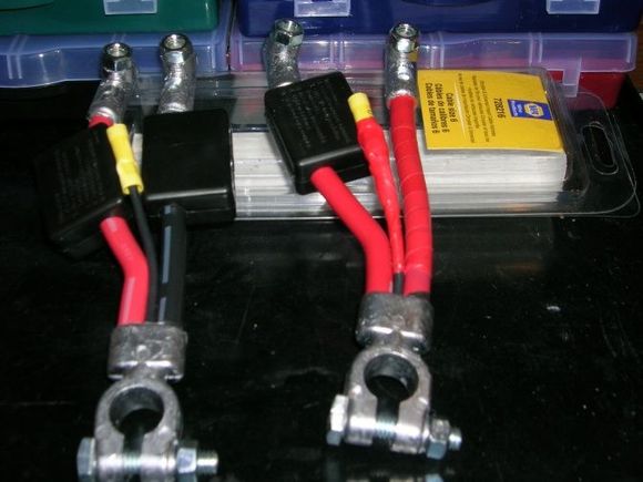 Napa's Part Number = 728216. Cost = $24.95 Ea. 

They come with red and black wire like the one on the left side of this photo. I used red and black electrical tape to make all the wires coming out the same color in an effort to make them Idiot proof if I need a jump start. I also wraped the splice with tape to help keep moisture out even more than the box does. Was thinking of filling the box with silicon caulk...