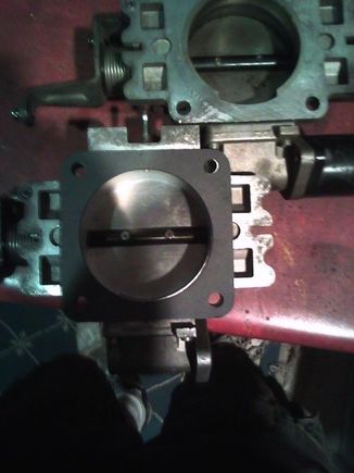 bored 63mm tb vs stock size, stock on top right, bored on bottom left