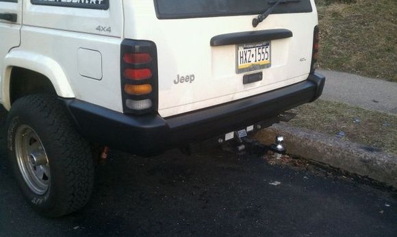 Primed and bedlinered rear bumper, installed end caps.