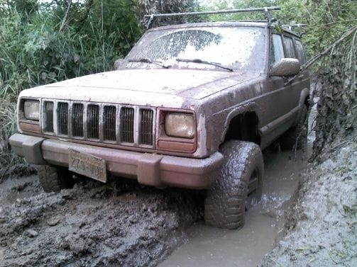 First time stuck. Front end sitting in mud. Time for newer/bigger tires.