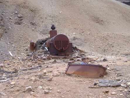 Governor Basin Road, Virginius Mine
My youngest JAYCE - 5 at the time- decided that this ore cart was an old choo choo train, and climbed in for a ride!! Fact is- ore carts are part of a small train used to haul ore and tailing out of the mine!! The old boiler in the back ground is still in pretty good condition for being over 100 years old.. Looking south east