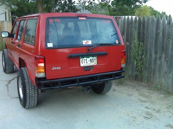 Rear...tucked in 2".  No more scraping.