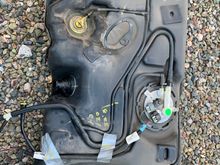 In September, started smelling a strong gasoline odor inside the car when the tank was full.  Ordered the vapor line assembly from Rock Auto and installed it today.  This is what the top of the tank looked like before I cleaned it and installed the new vapor lines.  