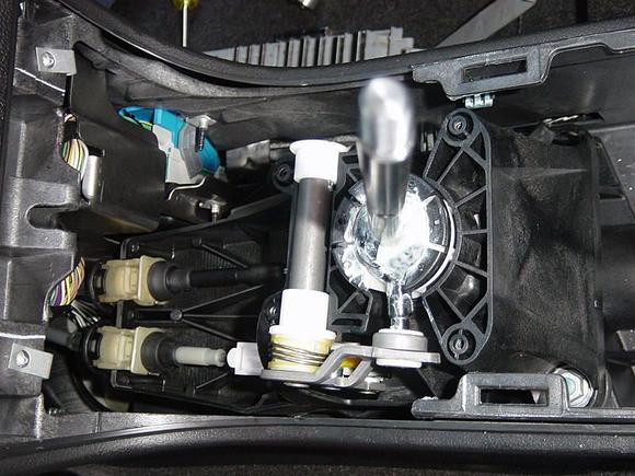 A photo with the console top removed , is it the shaft with the white nylon bushings?