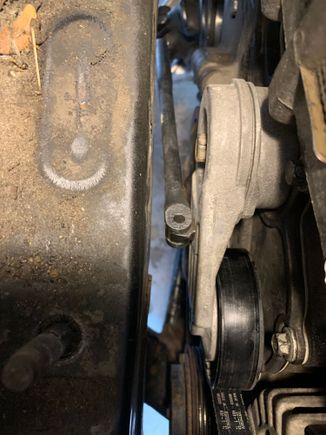 I used my Craftsman 3/8” breaker bar to relieve tension on the serpentine belt , it fits from below 