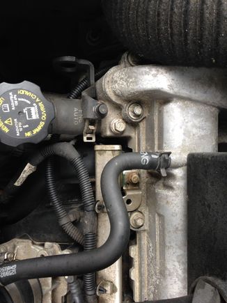 Follow this hose to the elbow above the throttle body.