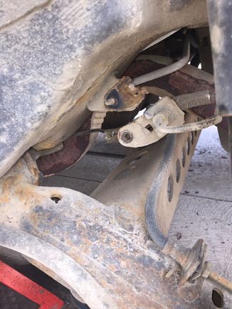 It’s an M6 nut that holds those brackets in place