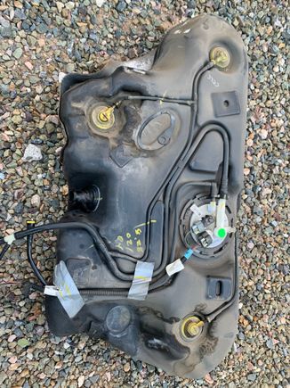 In September, started smelling a strong gasoline odor inside the car when the tank was full.  Ordered the vapor line assembly from Rock Auto and installed it today.  This is what the top of the tank looked like before I cleaned it and installed the new vapor lines.  