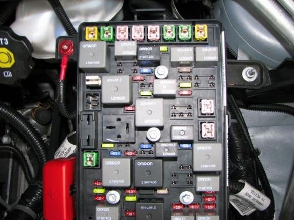 The lug on the upper left is the power steering motor cable.
Under the red cap on the lower left is the cable from the battery, then the cable down to the starter