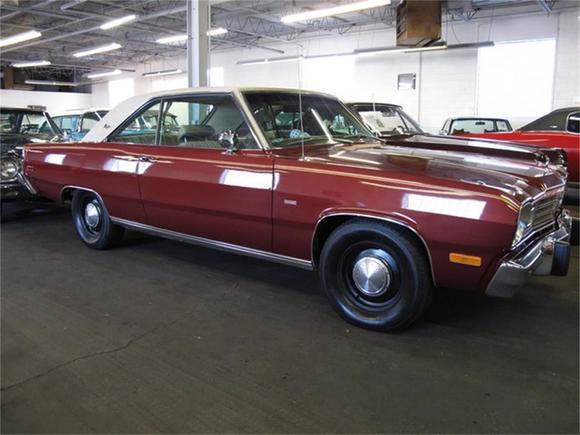 This one is very close to mine! Burnished red metallic and vinyl roof are the same , I had 15 inch police /taxi cab rims
