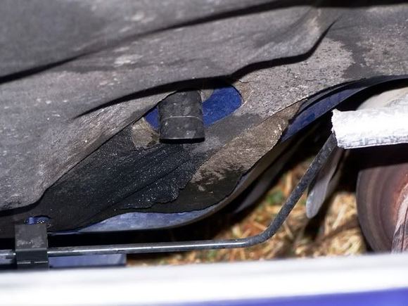 That’s the hose on the passenger side of the catalytic converter 