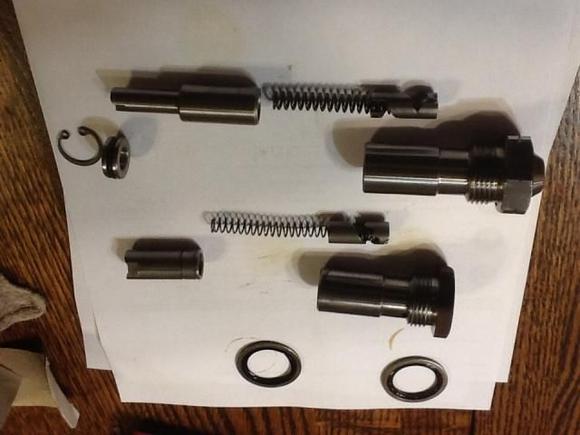 These tensioners have release mechanisms to apply spring tension after you tap the chain shoe to release the spring pressure. 