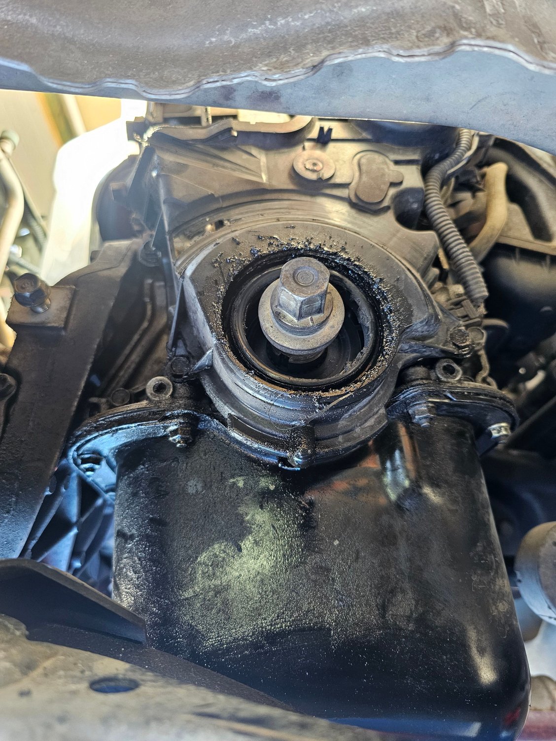 #3. Lower timing belt cover shredded around the Crank area, and harmonic balancer off.