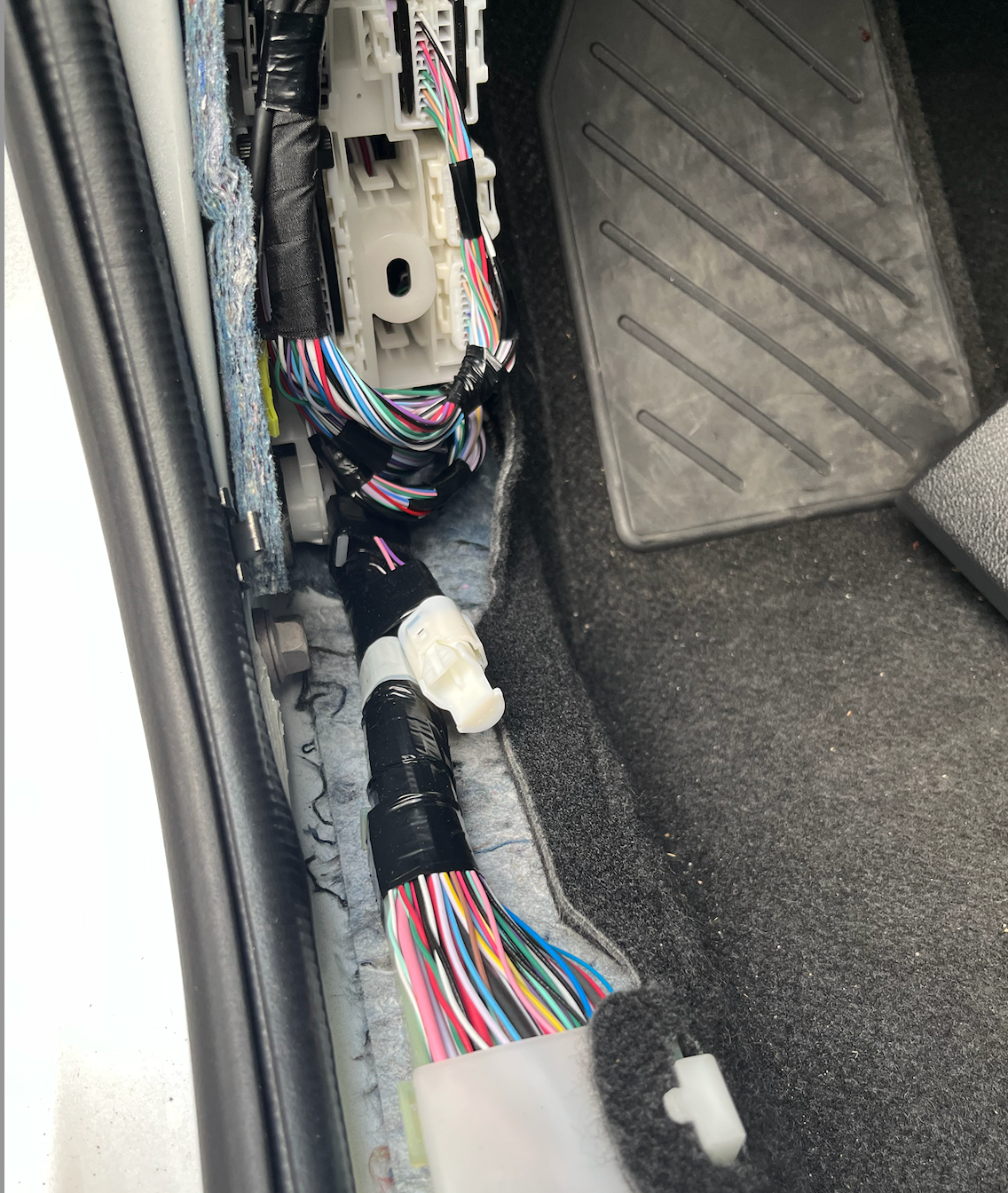 The white plug is where the new door sill will plug into. There is a termination plug inside that needs to be removed first by pushing down on the tab and pulling out on the plug