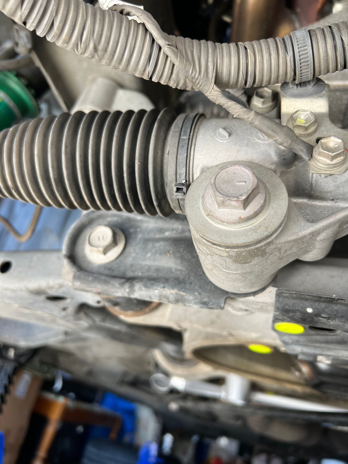 First remove these two bolts on each side. 