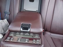 Rear controls with the cool box in the middle. Side manual shades, heated seats, seat massagers, reclining seats and more.