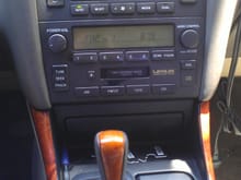 Stock radio with an AUX in mod... (invisible goes to the armrest)