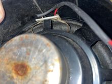 Driver side speaker, torn connection wire (red)