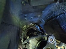 This is where the super long extension and some leverage comes into play.

1. Lower the rear of the transmission so that you can see all of the bellhousing bolts.
2. Get a super long extension that enables you to reach them from the rear of the transmission.