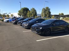 6 car lineup of Subarus almost all WRX