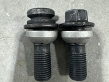 The wheel lock bolt on the left. The original bolt that came from the car is on the right. As you can see, it is 100% same style and size. 
