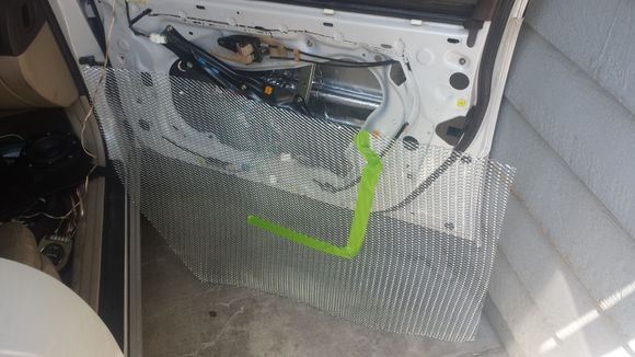 After Installing the GTMAT 1st layer (peek inside of door opening), and beginning the prep work of the GTMAT 2nd layer screen.