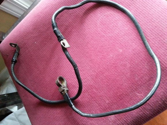 The original negative battery cable assembly in retirement.