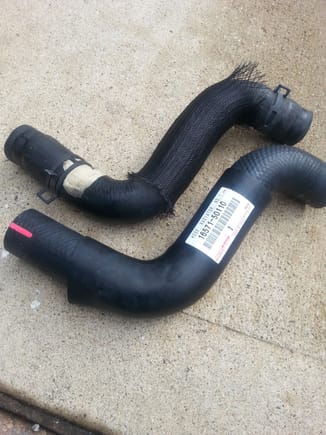Aftermarket hose on top contains a wire mesh sleeve which does nothing but make you think you are getting something more.
The OEM hose has solid formed rubber outer insulating sleeve which also serves to help hose retain its shape.