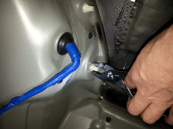 Set the lense on a towel to prevent scratching paint on bumper...
(Trunkside) Use pliers to compress lances on plastic clips and they should easily expell through to the  lense side.
