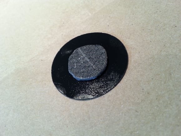 Boom Mat thick vinyl plug adhesive side is centered and pressed onto adhesive side of new OEM  plug.
In this way the thicker Boom Mat material resides in hole, while the low profile OEM material adheres to panel surface.

