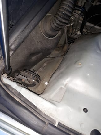 This area is vacant in 1998-2000 LS400, so it tends to collect dust and dirt bevause the oblong mounting holes for the cruise control  assembly were not plugged.