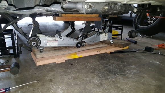 The drive up ramps I left under the car for added safety. I supported the vehicle with 6 ton jack stands on the frame of the car. My jack stands are padded and still left slight marks in the frame. I suggest using a piece of 2x4 or similar wood between the jack stand and the frame.