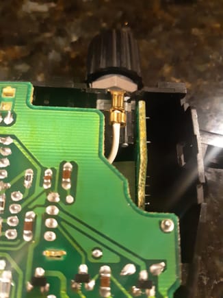 Have removed back cover of brighnrss control assembly to better illustrate fit of the APM part inside the knob cavity.. Here knob is not pushed in all the way.