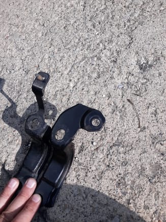 1999 steering rack bracket on left, 1993 on right. The 1999 bracket has an extension with threaded end to help secure under cover. The 1993 has a tang for mounting the steering damper. The 1993 bracket can easily be modified to accept the 1999 under cover mount.