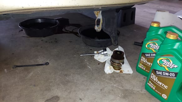 You'd think with a 2 foot diameter pan I would catch all of the oil.  I had 4 quarts in one, 5 quarts in the other.  Plus whatever is on the floor.  Over 9 quarts drained after 5000 miles, pretty good.  If the pcv valve is leaking it's not much.