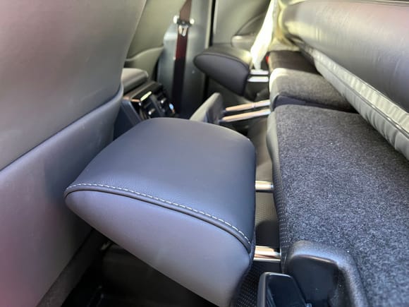 I saw a tip on the RAV4Prime reddit about flipping the headrests to provide support for the top of the air mattress. That worked well but they do not clip this way and can fall out. It can be solved by bringing the front seats a little closer.