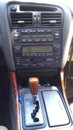 Stock radio with an AUX in mod... (invisible goes to the armrest)