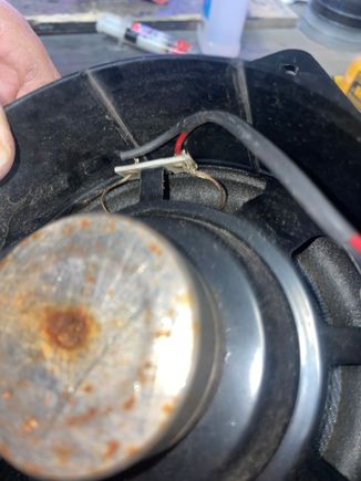 Driver side speaker, torn connection wire (red)