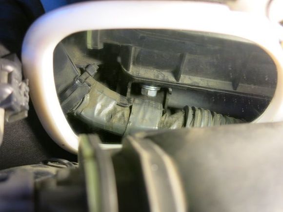Here is the PITA bolt on the passenger side that needs to come out to remove the intake.  You need a 12mm flex head wrench.
