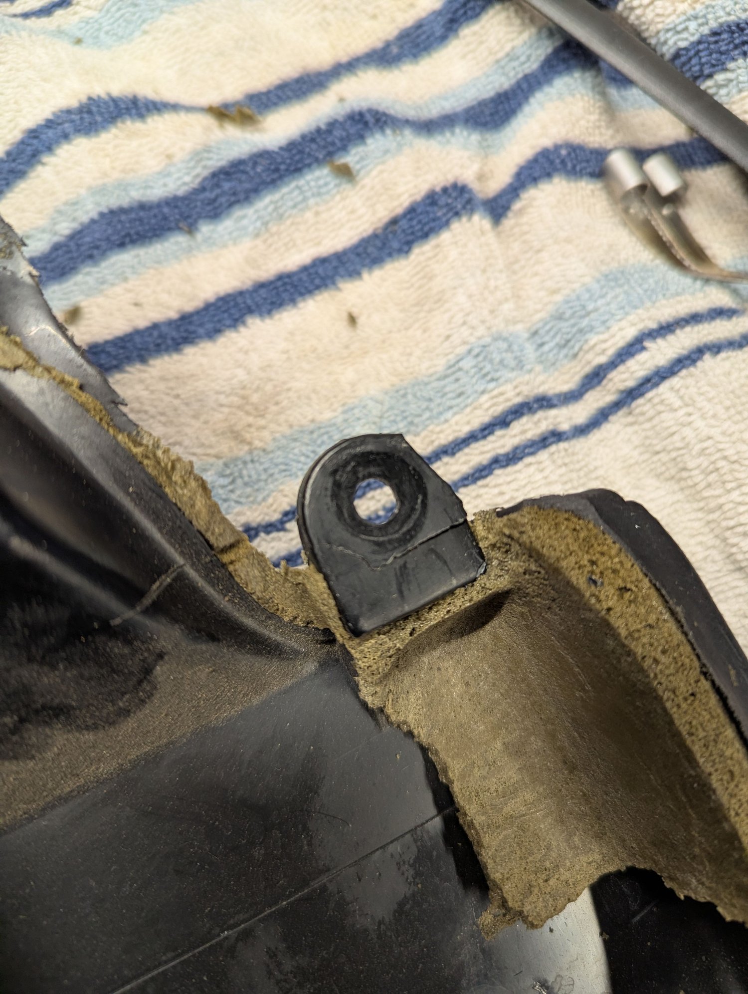 Almost broken off door panel tab.
