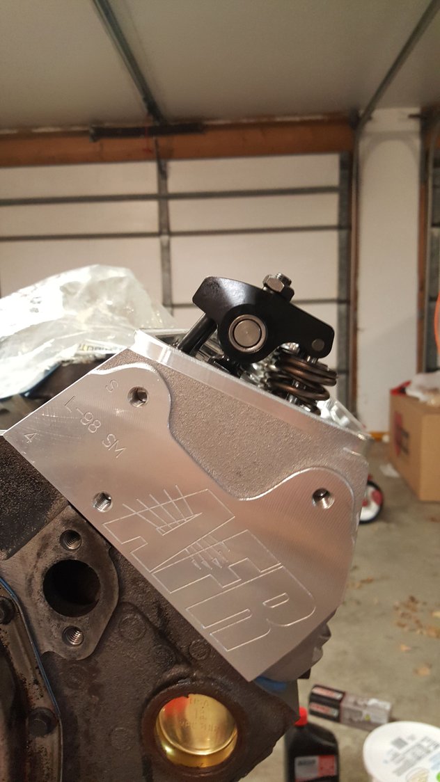 selfaligning rocker arms vs. adjustable pushrod guides