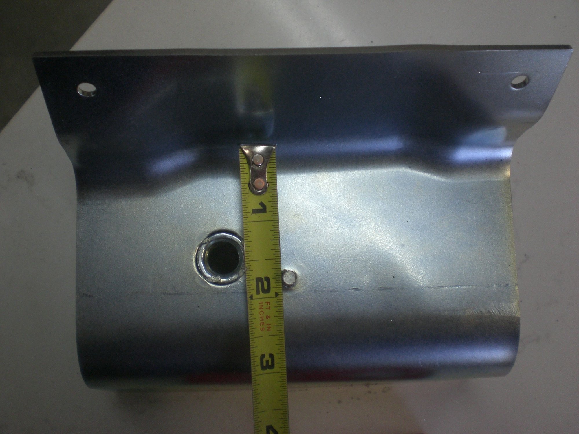 Mount plate has welded nut for belt reel and locating pin