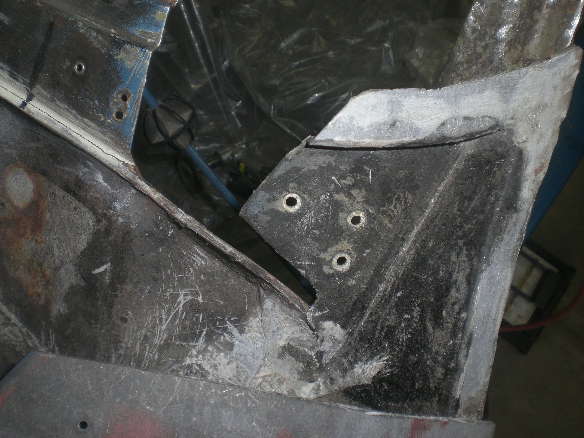 Where to cut the bonding support to provide the best access to the outer corner while still be able to reattach it so as to provide the best support to the fender tip when it is reattached?