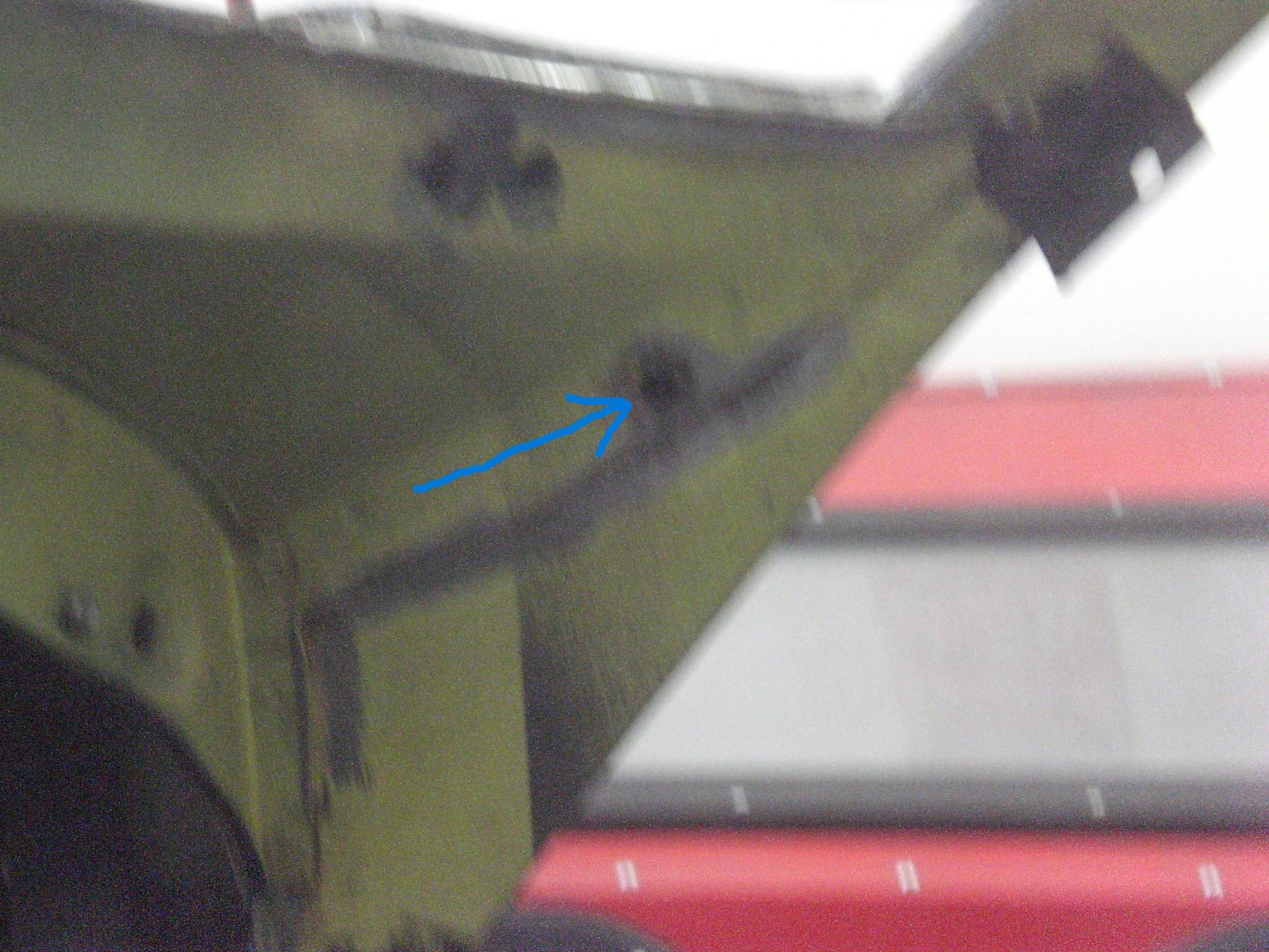 Indicated hole allows access, but only about 3-4