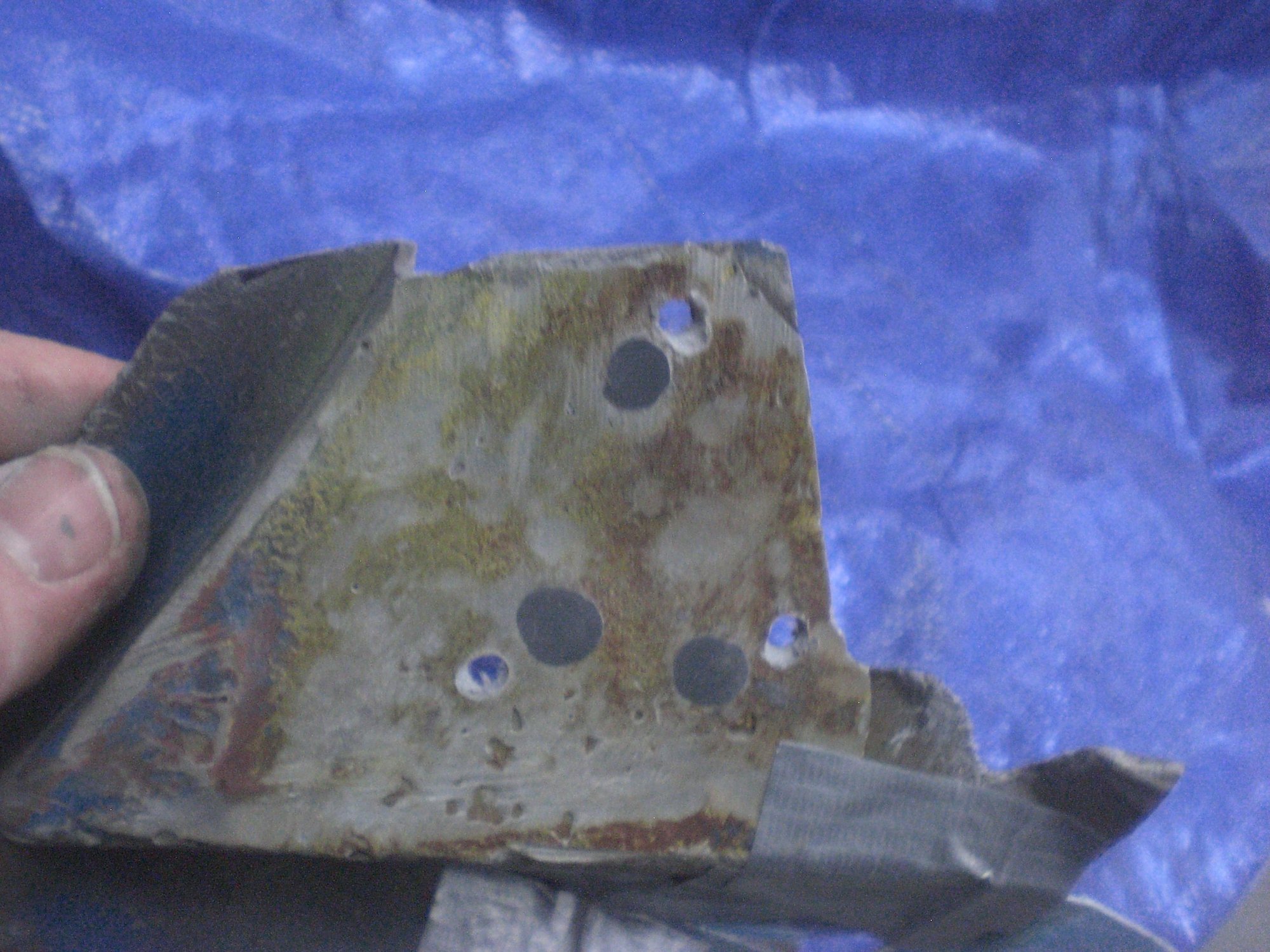 3 redrilled rivet holes in the mounting structure