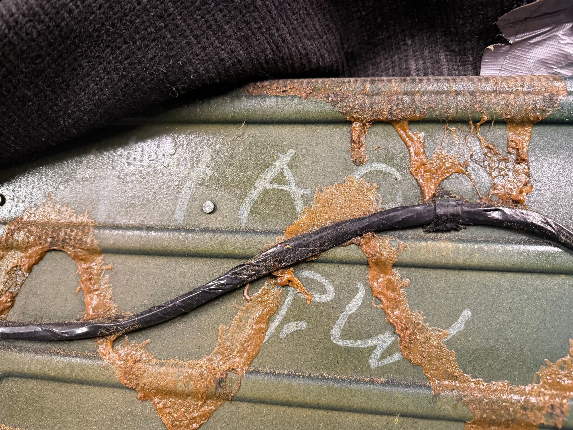  Rear panel behind drivers seat. 