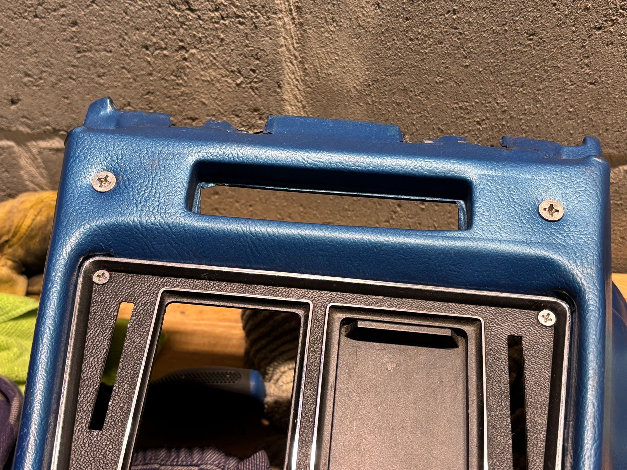 The other brackets are held in place by bolts the go through where the fiber optics warning light bezel slots through.   The bezel will not be needing these holes, it will be interference fit. 